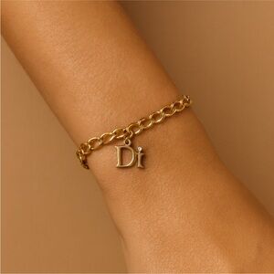 Diamond International Gold-Tone Bracelet with DI Logo